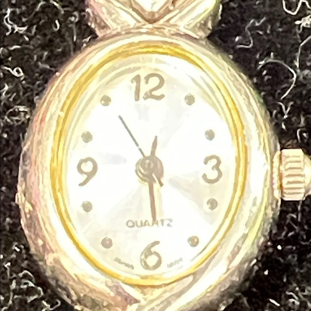 Vintage Avon silver and cat eye watch